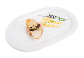 Salmon tartare with black truffle sauce.