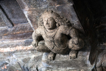 Fototapeta na wymiar Stone figure of Bharvahaka Yaksha in Ajanta caves, India