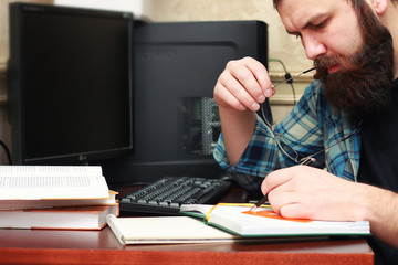 man write pen table