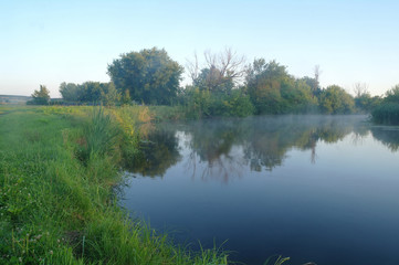 Fototapeta na wymiar Morning landscape with fog on the river