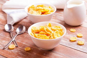 Cornflakes and milk for breakfast closeup