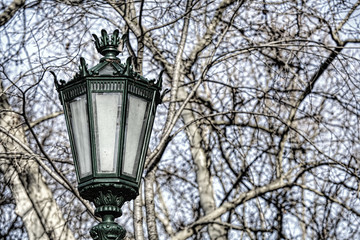 Fototapeta na wymiar Typical metal street lamp at Lisbon (Portugal).