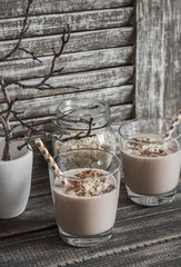 Breakfast chocolate, banana, oatmeal smoothies. Healthy beverage. Rustic style