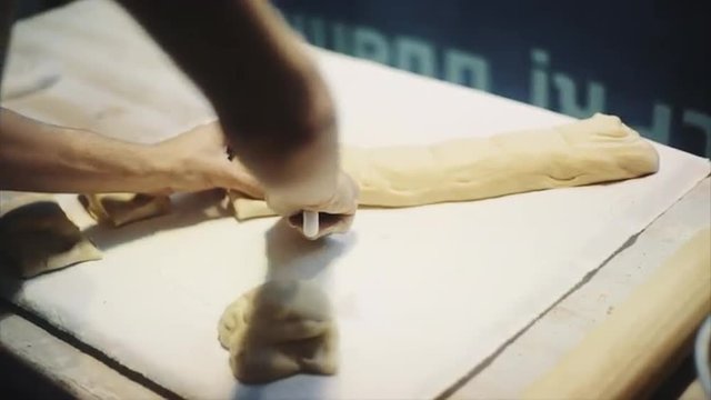 Cook Cuts The Dough