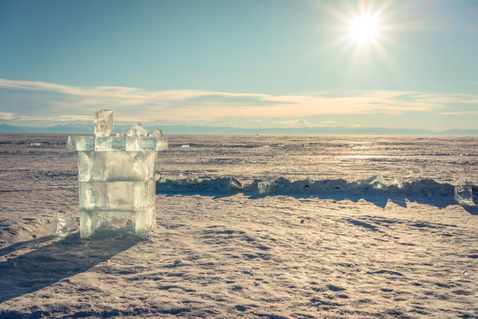 ice cube sculpture tower shape on frozen baikal lake