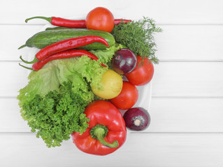 Vegetables for the salad on a plate.