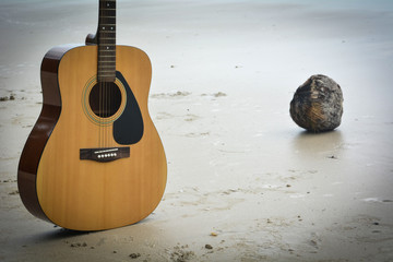 Guitar on a sandy beach