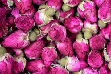 Rose tea - dried rosebuds flowers texture closeup. Dry roses petals for Asian tea and spices. Copyspace for element or background. - obrazy, fototapety, plakaty