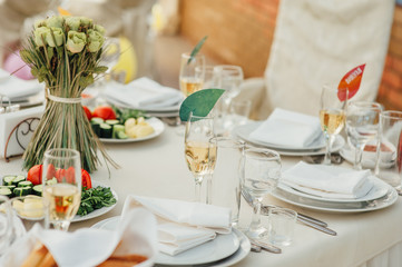 Wedding glasses filled with champagne at banquet