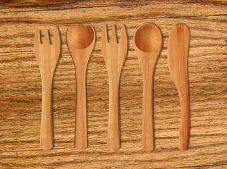 Wooden Kitchen Utensils on cutting board background