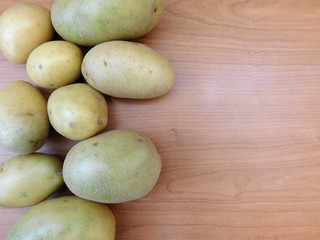 potatoes on wooden base