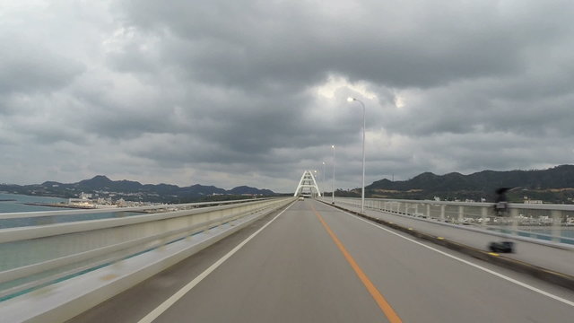 Driver's POV over the bridge connecting Sesokojima, Okinawa.