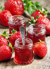 Strawberry confiture with whole berries and fresh strawberries o