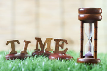 Sandglass and wooden alphabet, Time management concept and Time up idea