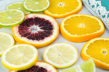 Fototapeta na wymiar Assortment of cut citrus fruits.