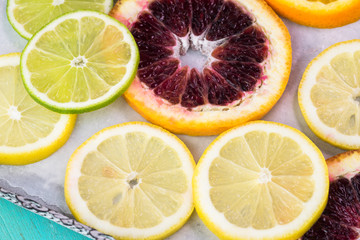 Fototapeta premium Assortment of cut citrus fruits.