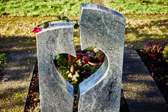 Gravestone with heart withered rose / Tombstone with heart on graveyard
