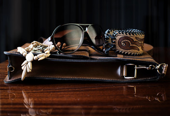 fashionable accessories. Bag, sunglasses and decorations