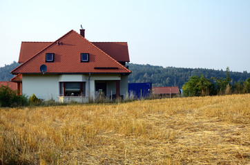 Landscape with field and house