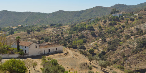 Fototapeta na wymiar Farms and Mountains Around the mountain village of Carratraca Andalucia Spain