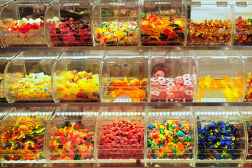 Colourful fruit jelly in plastic boxes, close up