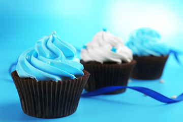 Chocolate cupcakes on blue background