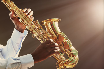 Fototapeta premium African American jazz musician playing the saxophone, closeup