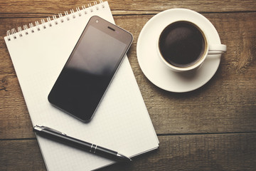 coffee with notebook and phone