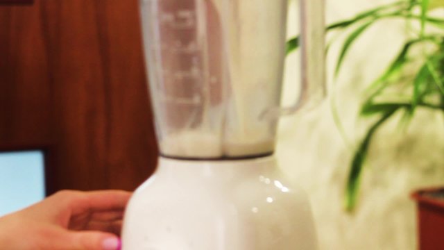 She is Preparing a Milk, a Protein Shake.