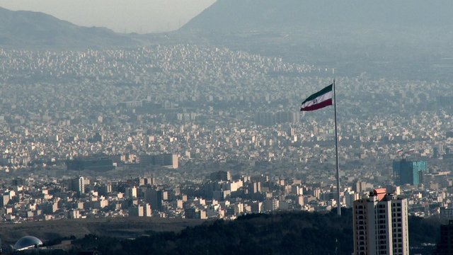 TEHRAN, IRAN JANUARY 2015: Iranian flag in the middle of Tehran city.