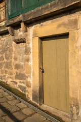old wooden door in a sandstone wall
