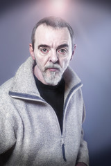 Portrait of a man made-up as devil