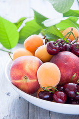 Naklejka na ściany i meble Bowl of mixed fruits and berries