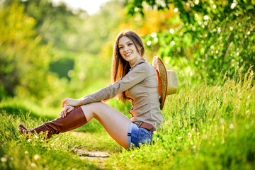 young beautiful girl in a cowboy hat