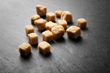 Pile of brown sugar cubes on the table
