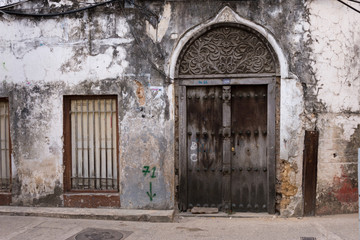 traditional wooden ornate door in stone town, zanzibar, tanzania