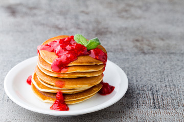 Stack of pancakes with fresh berry.