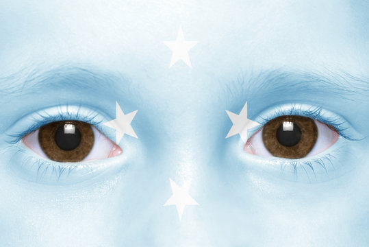 human's face with federated states of micronesia flag