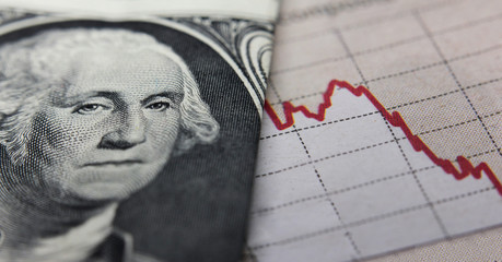 Stock Market Graph next to a 1 dollar bill (showing former president Washington). Red trend line indicates the stock market recession period