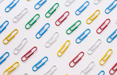 colored stationery paper clip on a white background