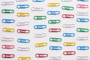 colored stationery paper clip on a white background
