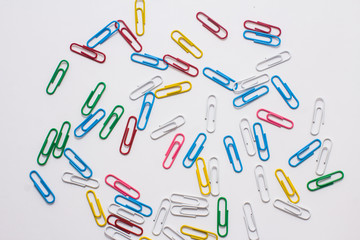 colored stationery paper clip on a white background