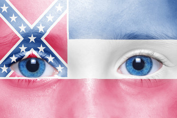 human's face with mississippi state flag
