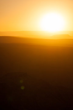 Sunset above desert dunes in Africa.