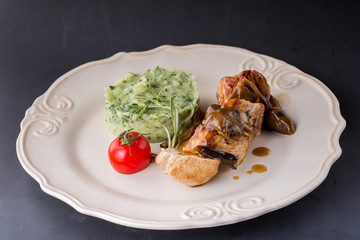 chicken meat with mashed potatoes over white table