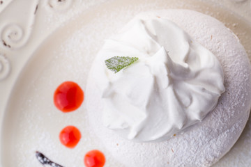 white bizet cookie on white plate. top view