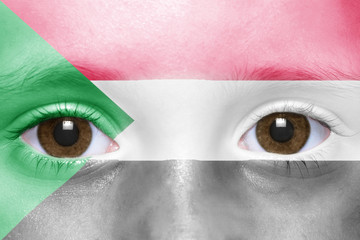 human's face with sudanese flag