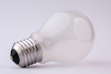 White light bulb on a white background
