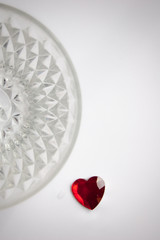 Red heart on a white background with a crystal semicircle
