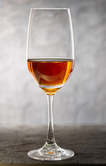 Glass of amontilliado sherry on wooden plank